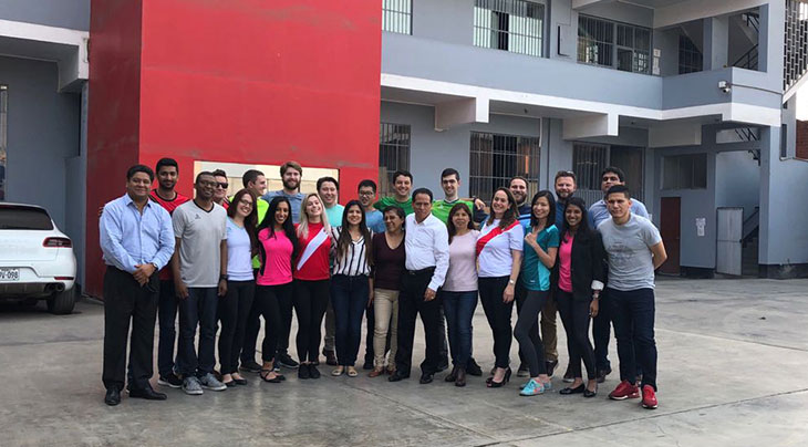 Full-Time MBA students pose for a photo outside of the Walon factory in Lima, Peru.