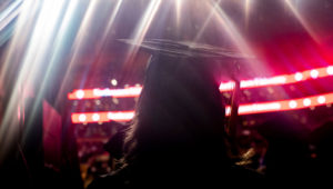 A graduate looks on during commencement