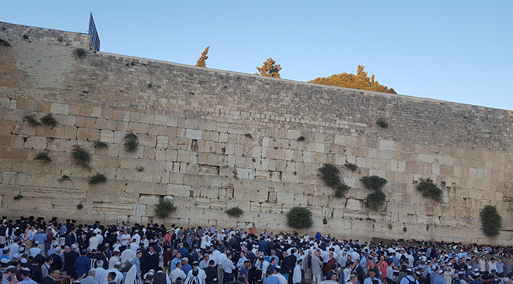 People gathering at wall Jerusalem, Israel