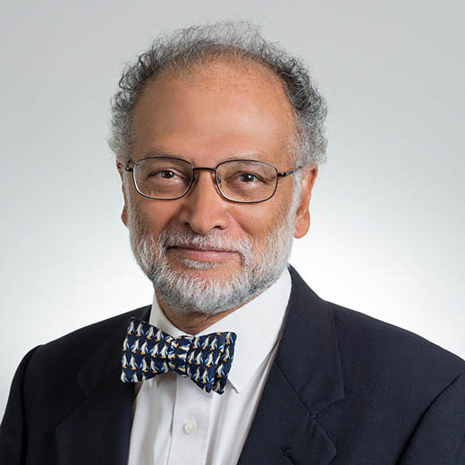 Ravi Sarathy, man with gray hair wearing glasses and a bowtie