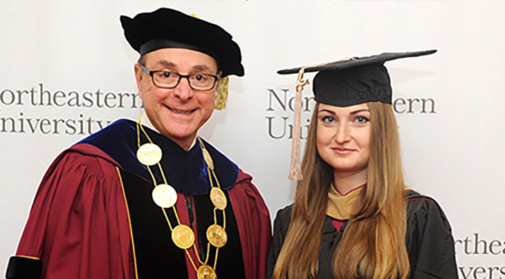 photo of a man and young woman wearing graduation cap and gowns