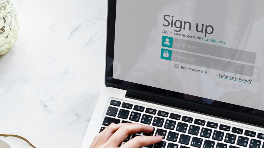 laptop and sign up form