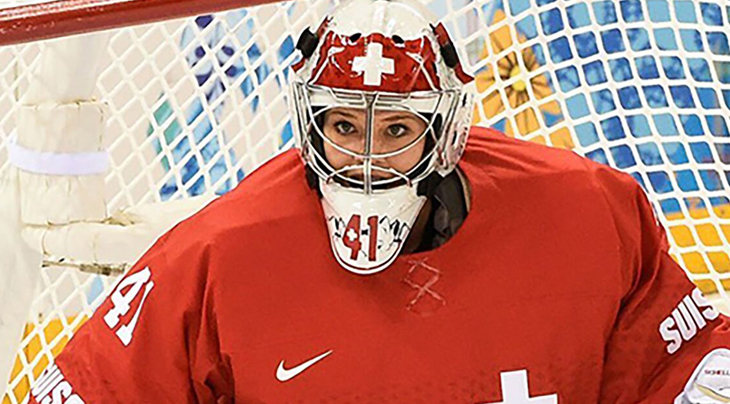 Photo of a female hockey goalie in her helmet