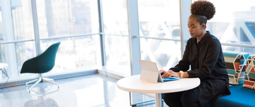 Female student Watching a Webinar on her laptop