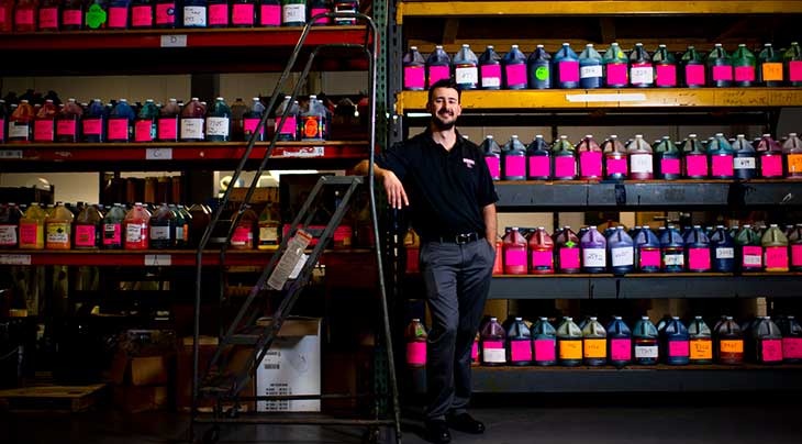 Ryan Dunlevy, a Northeastern graduate poses for a photo as his family business.