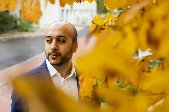 Visiting Assistant Professor Shawn Bhimani poses for a portrait on Oct. 30, 2019.
