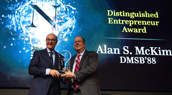 Alan S. McKim accepting the Distinguished Entrepreneur Award from President Aoun.