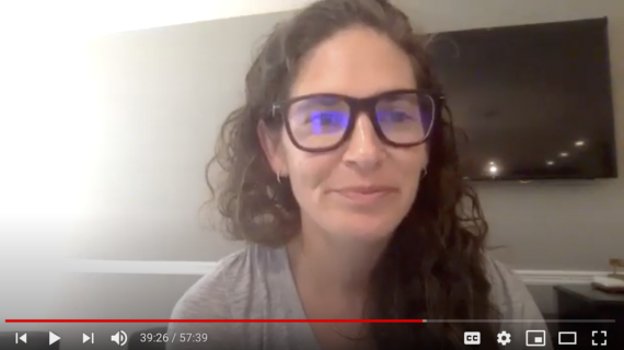 screen shot of a youtube video with a woman in glasses