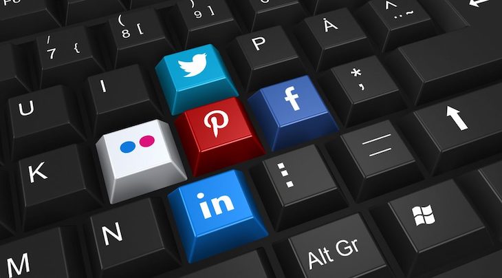 a computer keyboard features social media logos