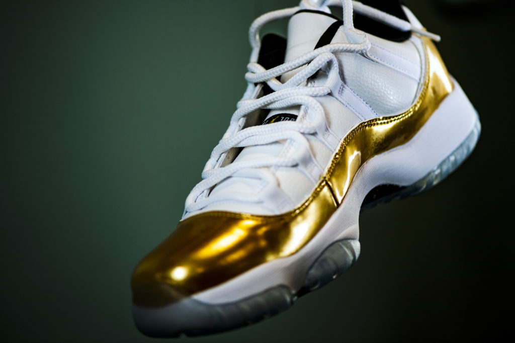 white and gold sneaker