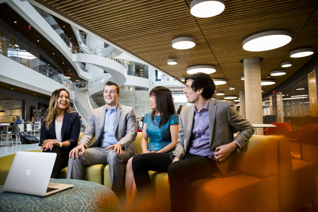 students sitting and laughing in ISEC