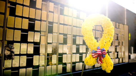 yellow flowers in front of veterans memorial at Northeastern