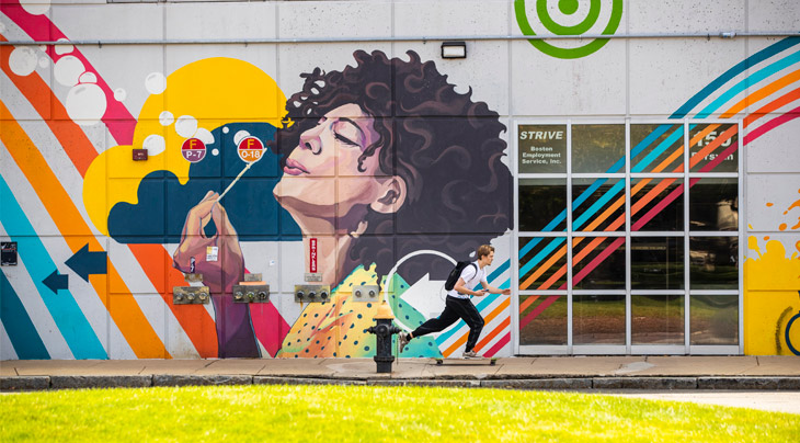 skateboarder by mural