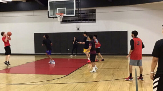 Students play IM basketball.