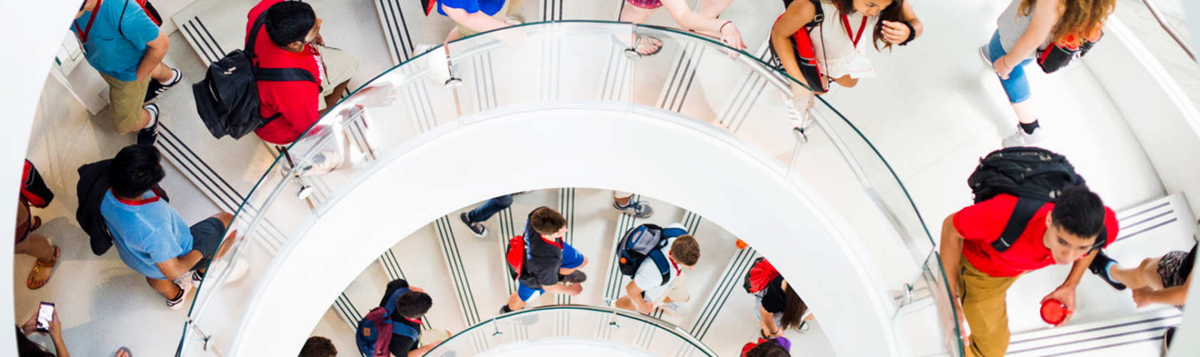 Students ascending and descending a spiral staircase