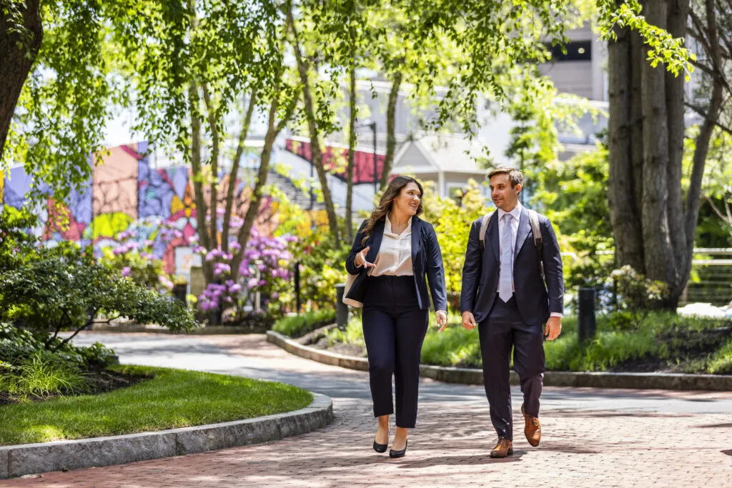 Two people walking around campus