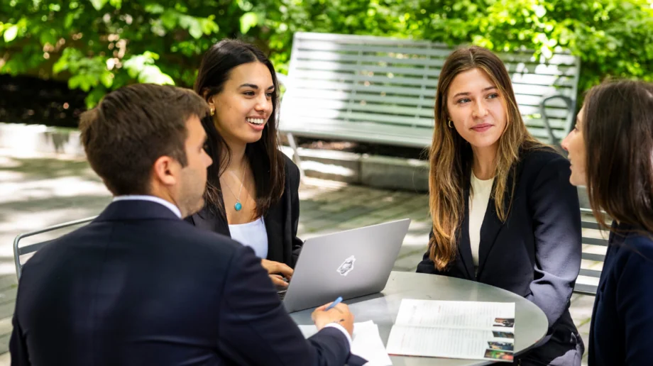 Four students sitting outside