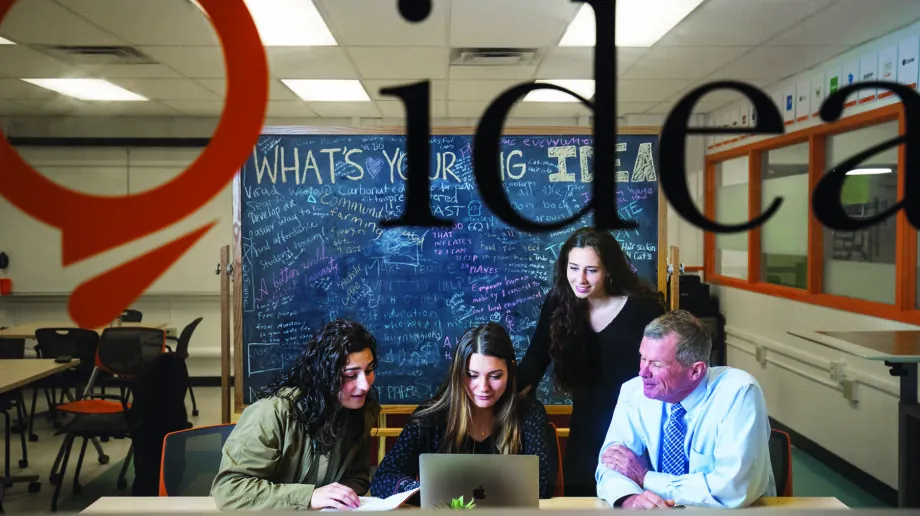 People looking at a laptop