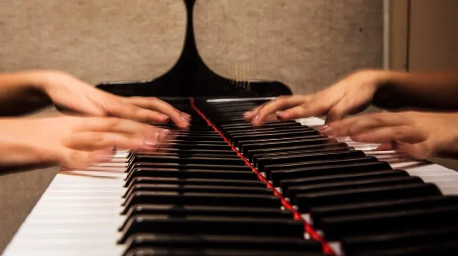 Close up of student playing piano
