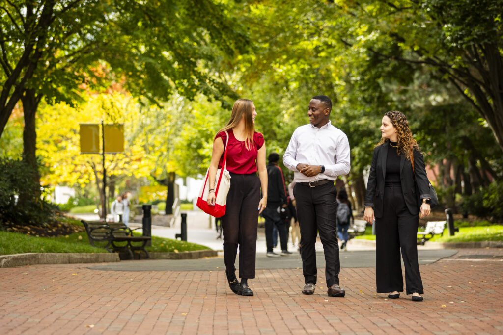 Three students walking on Boston campus