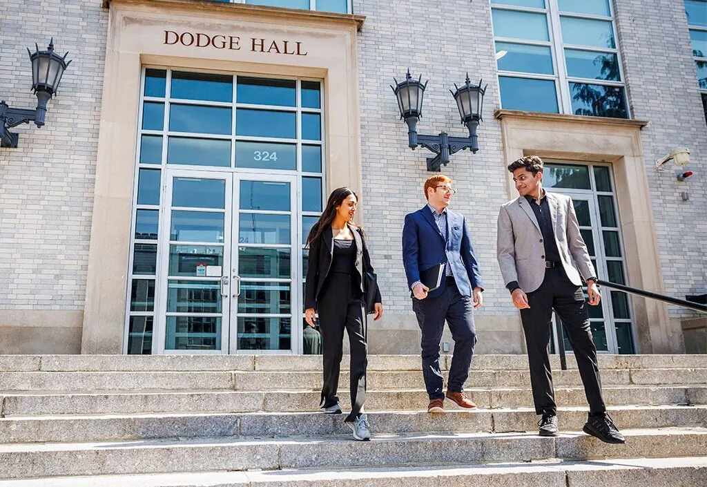 Three students in front of Dodge Hall