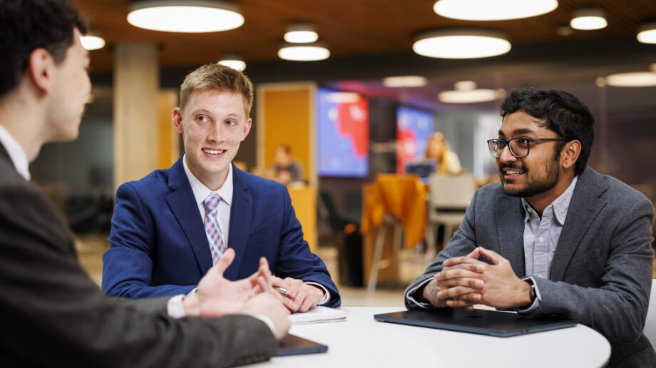Three students talking in ISEC